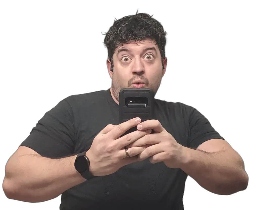 Brandon Mysliwiec holding phone with surprised expression – personal brand photo